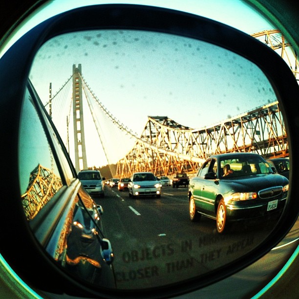 itskeilayo: In with the new and out with the old..🌉😱 #inwiththenew #outwiththeold #newbaybridge #oldbaybridge #onmywayhome #beautifulbridge #sideviewmirror